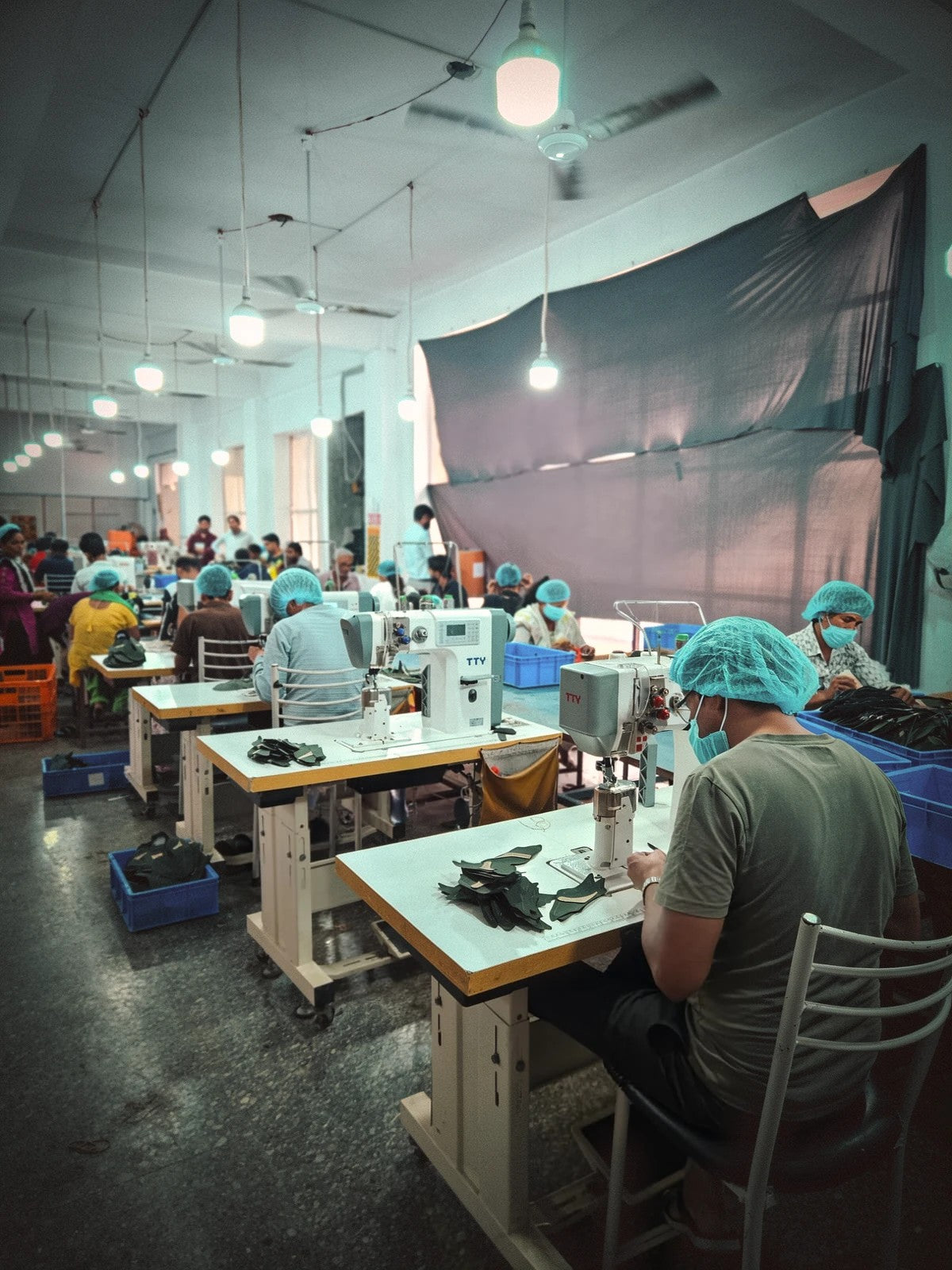 The stitching hall at the House, with the team at work