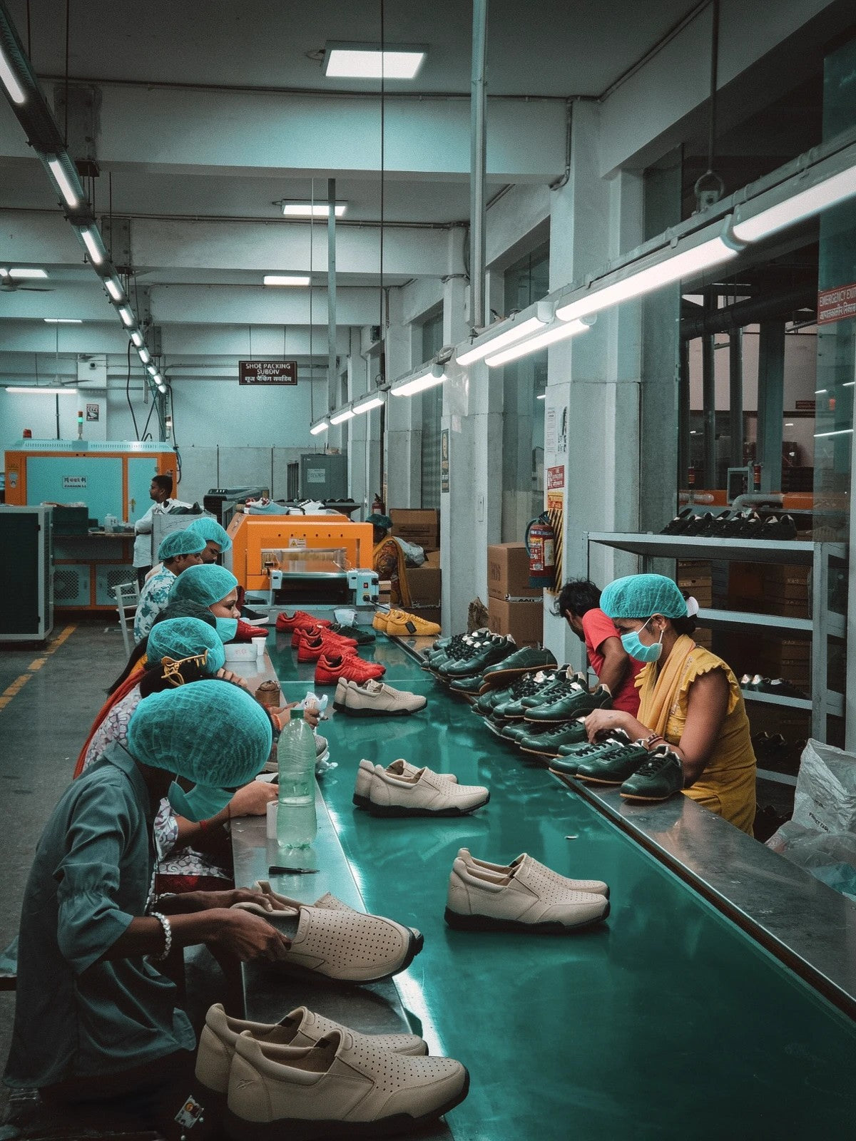 Finished pairs checked by hand on the packing line